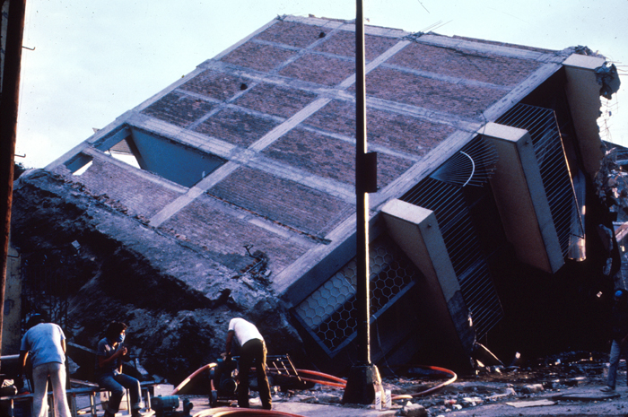 Mexico City Earthquake, September 19, 1985. Eight-story frame structure with brick infill walls broken in two. The foundation also came off. 